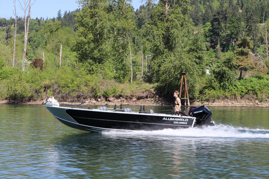 An Alumaweld Columbia 23' boat in motion on a body of water.