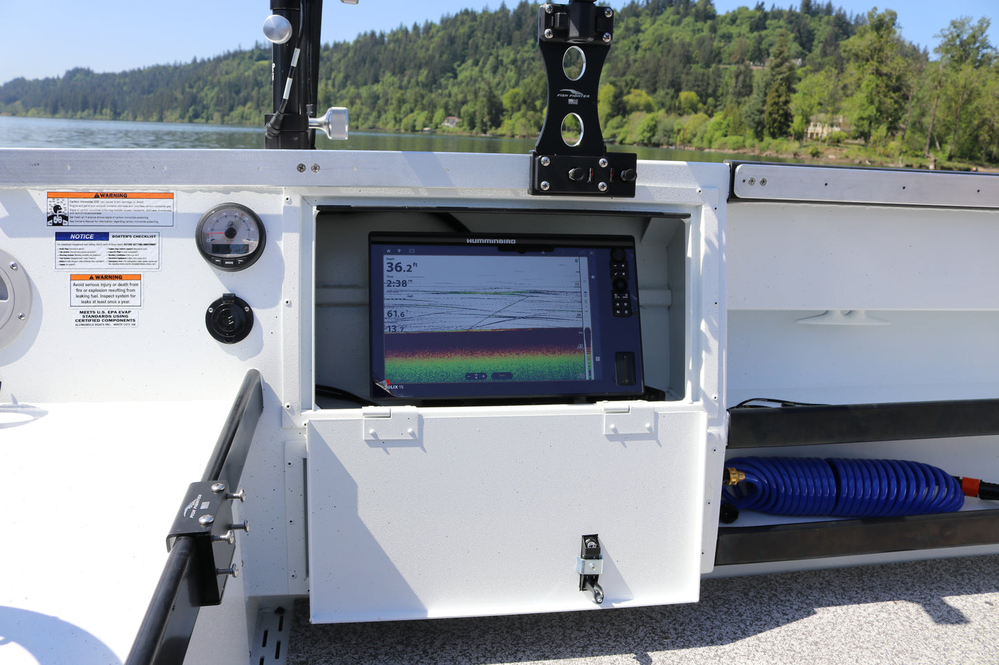 An Alumaweld Columbia 23' boat in motion on a body of water.