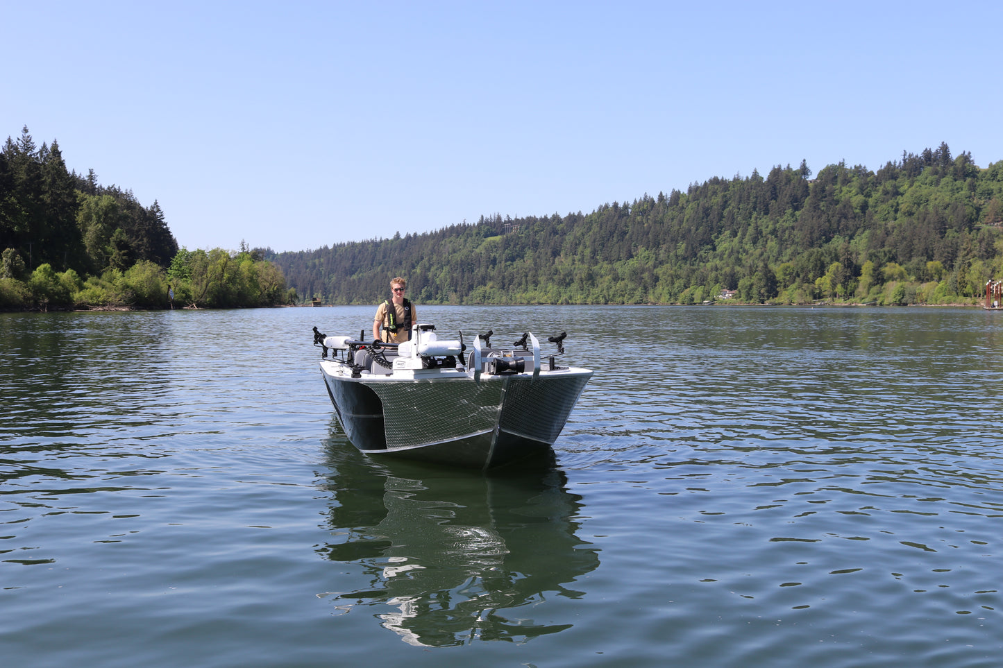 An Alumaweld Columbia 23' boat in motion on a body of water.