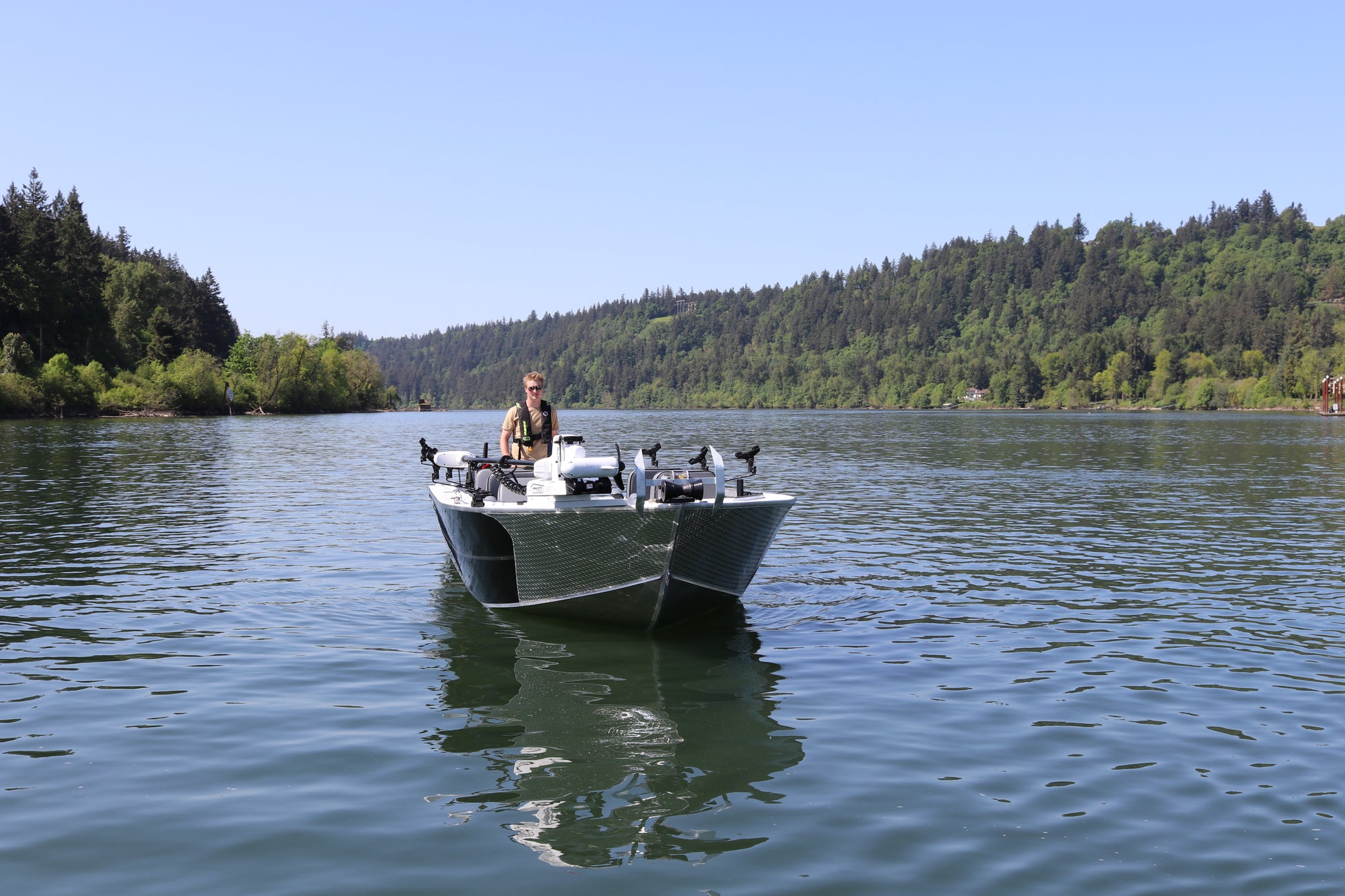 An Alumaweld Columbia 23' boat in motion on a body of water.