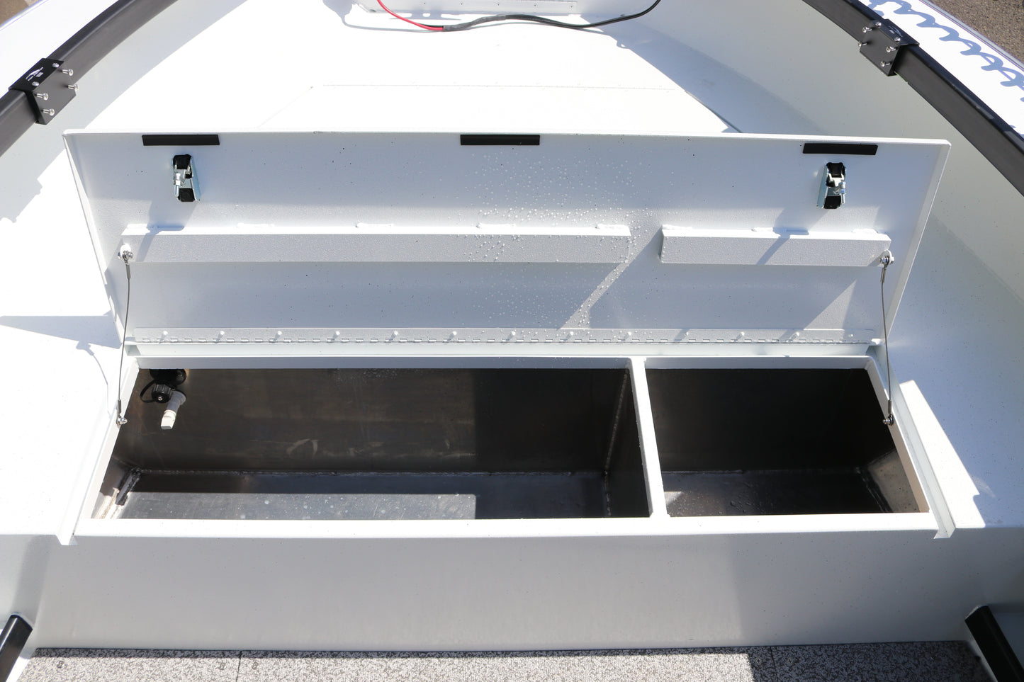 An Alumaweld Columbia 23' boat in motion on a body of water.