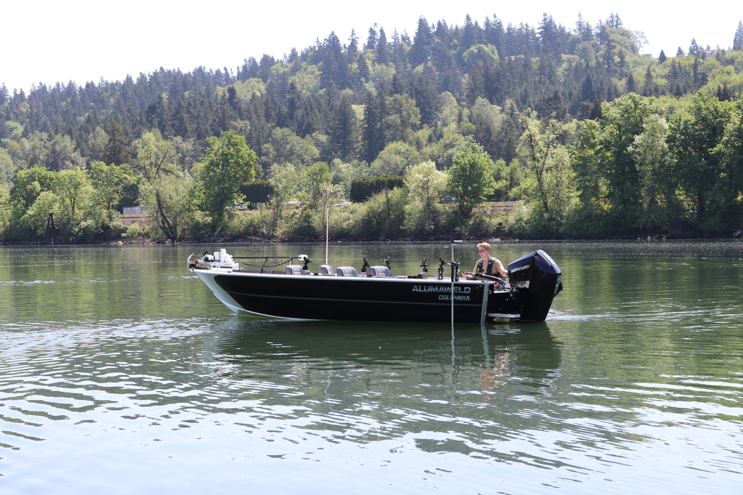 An Alumaweld Columbia 23' boat in motion on a body of water.