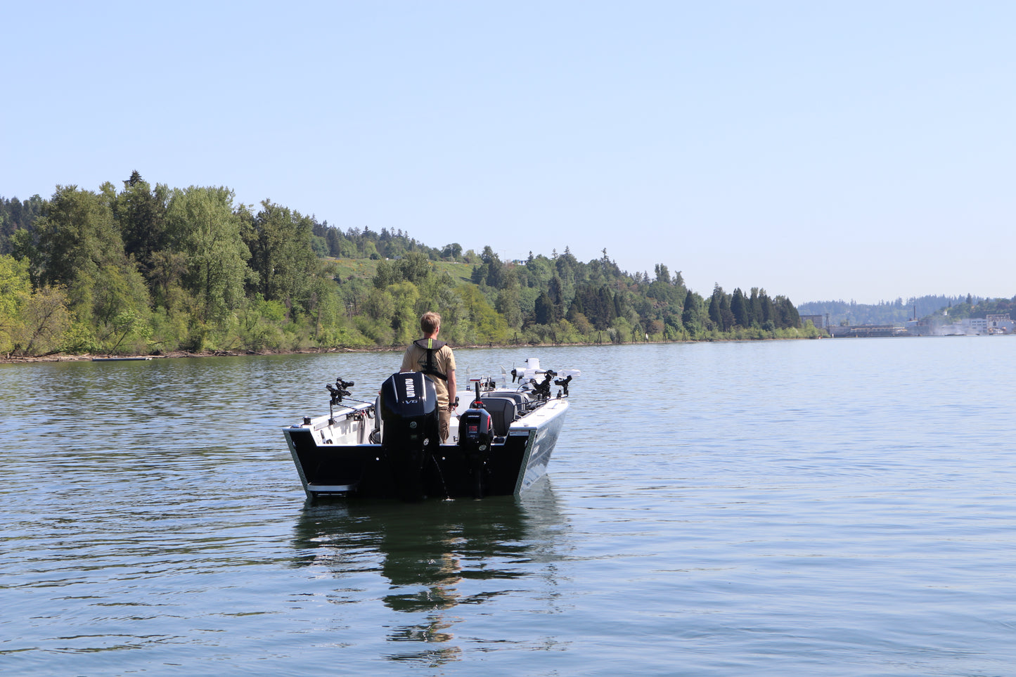 An Alumaweld Columbia 23' boat in motion on a body of water.