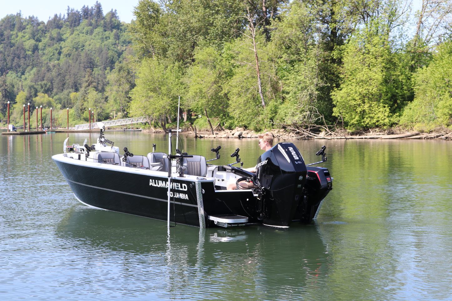 An Alumaweld Columbia 23' boat in motion on a body of water.