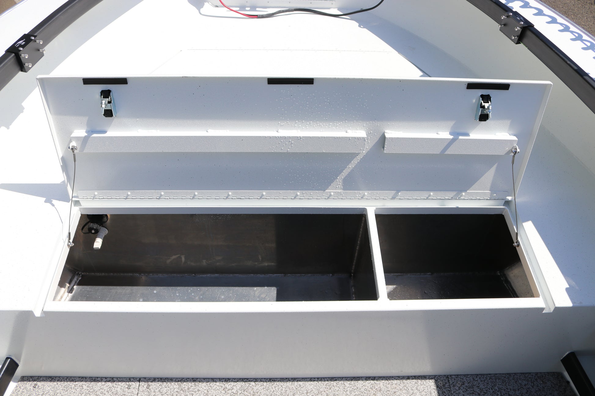 An Alumaweld Columbia 23' boat in motion on a body of water.