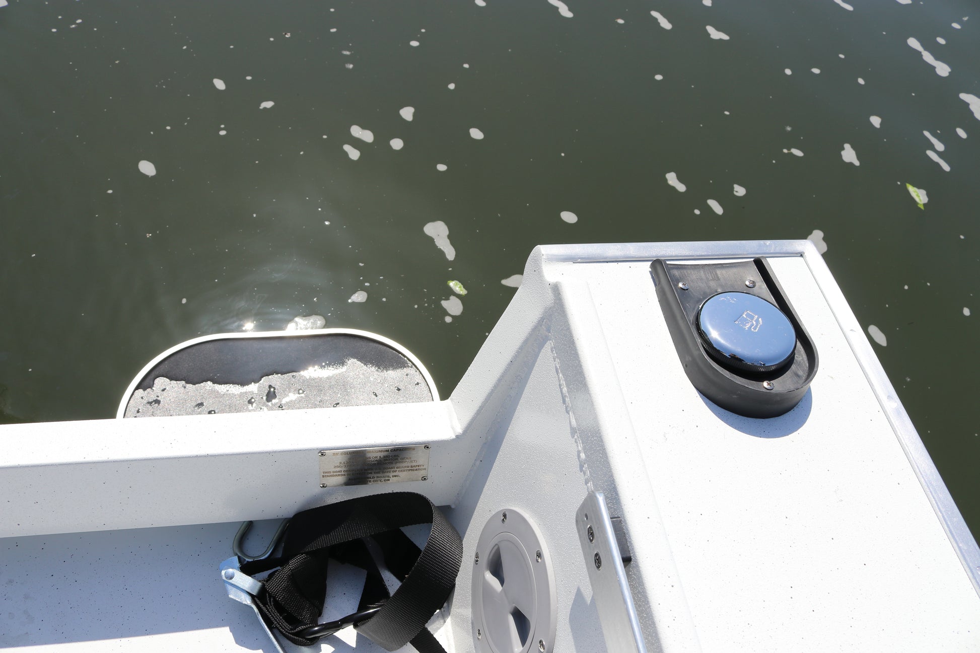 An Alumaweld Columbia 23' boat in motion on a body of water.